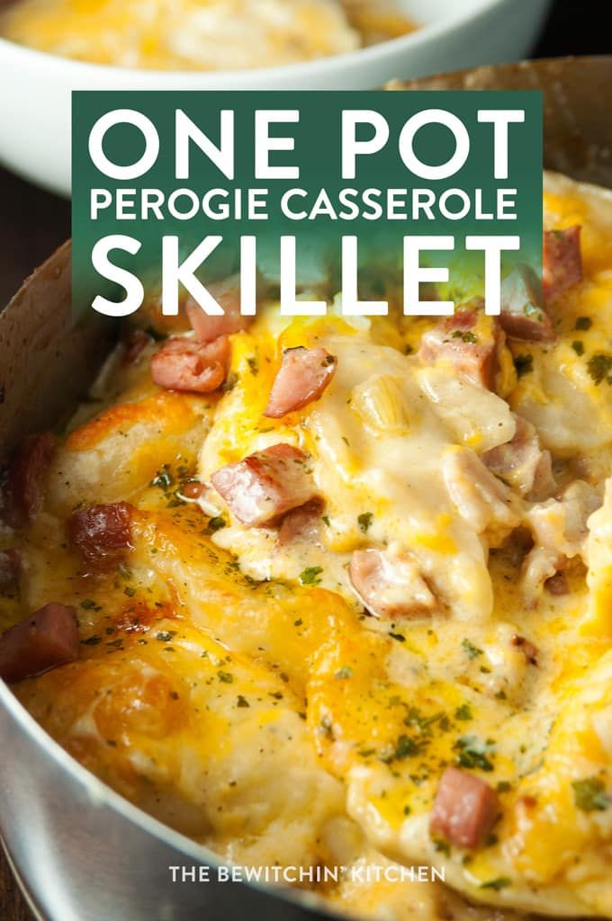 a skillet filled with potatoes, ham and cheese