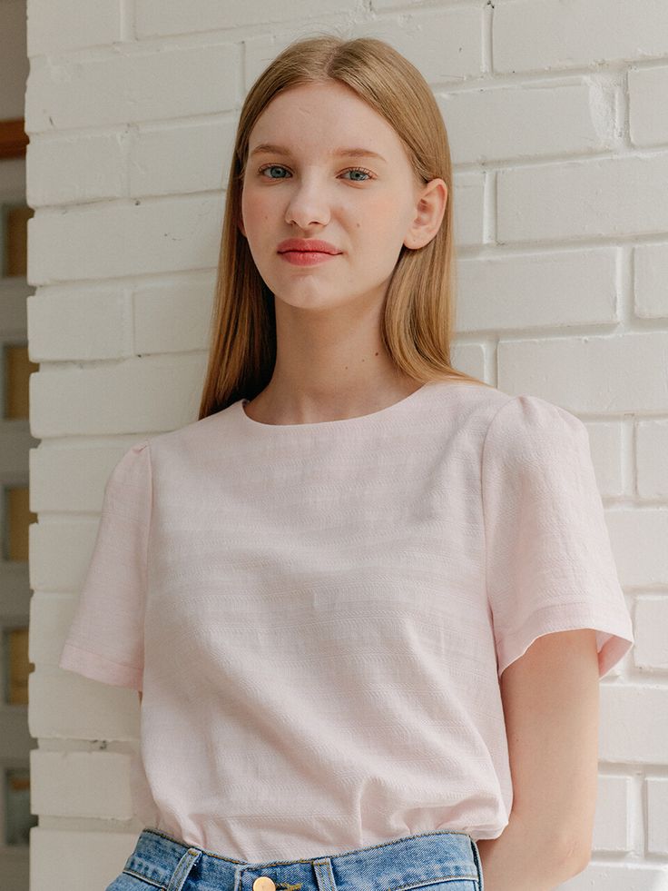 Editor's NotesThis top is made of rayon, linen, and cotton. It features a basic design, a volume sleeve, a minimal design, and a clean and neat look which makes the top more feminine. It can be worn with any item. It can be worn casually or formally depending on how you coordinate. - Classic design linen shirt- Round neck and relaxed fit - Comfortable fit and a must-have item - Jacquard fabric detail and easy to coordinate  Measurements(in.)One Size (XS-M)- Total Length: 23.03 in.- Chest: 18.70 in.- Shoulder: 13.77 in.- Sleeve Length: 8.66 in. Model info: Height 5' 64, Bust 29.5 in., Waist 23 in., Hips 35 in. Composition & Care- Shell: 63% Cotton 27% Linen 10% Rayon  - Dry Clean- Please check a care label Designer- by YUPPE Spring Linen Tops In Solid Colors, Linen Tops For Spring, Relaxed Fit Puff Sleeve Top For Everyday Spring Wear, Solid Linen Top For Work, Linen Workwear Top, Classic Linen Tops For Spring, Solid Linen Tops For Work, Linen Crew Neck Top For Work, Feminine Cotton Crew Neck Blouse