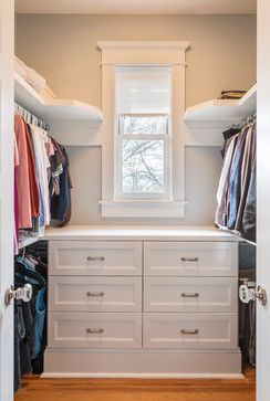 an organized closet with white cabinets and drawers is pictured in this image from the inside