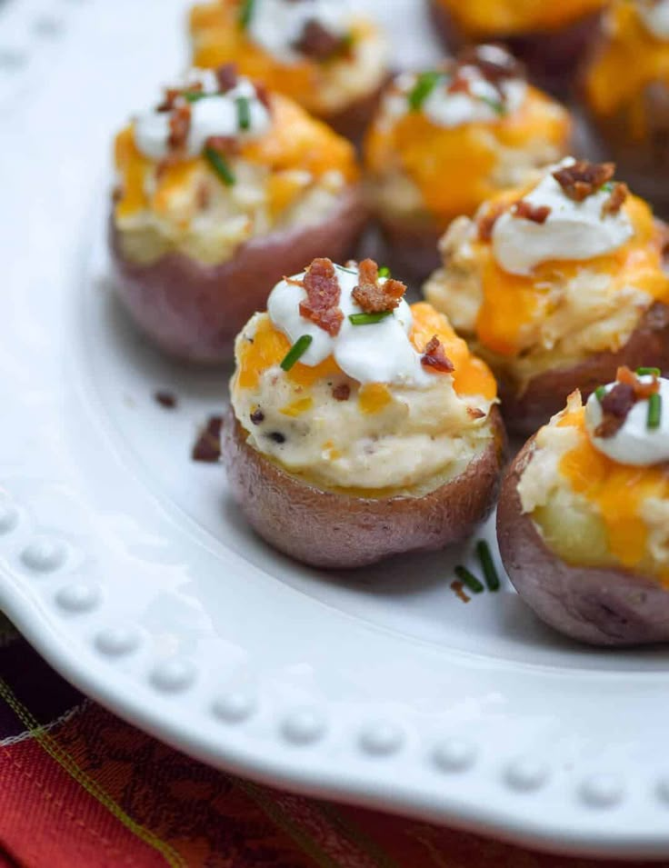 small appetizers with cheese and bacon are on a white plate