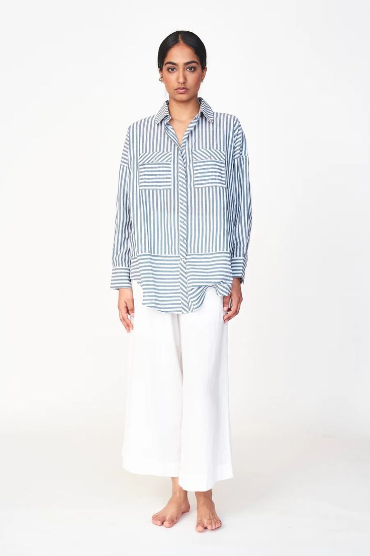 Oversized blouse with front button placket Gathered at back yoke Full length sleeves tapered at cuff with button closure Patch pockets on chest with button flaps Semi sheer 100% cotton Made in India Oversized Blouse With Roll-up Sleeves And Spread Collar, Daywear Shirt With Buttoned Pockets And Spread Collar, Daytime Shirt With Buttoned Pockets And Spread Collar, Classic Cotton Blouse With Buttoned Pockets, Button-up Workwear Blouse With Buttoned Pockets, Classic Daywear Blouse With Buttoned Pockets, Collared Blouse With Buttoned Pockets For Daywear, Workwear Button-up Blouse With Buttoned Pockets, Daywear Tops With Pockets And Shirttail Hem