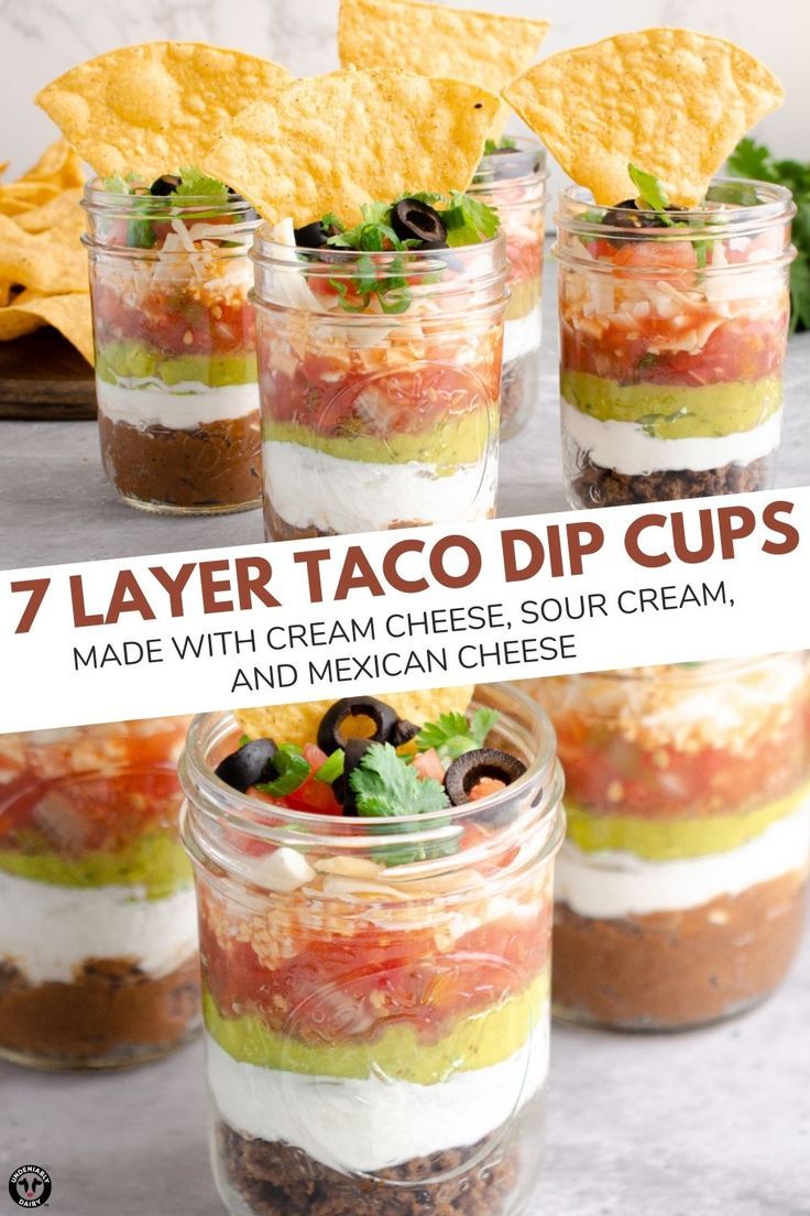 seven layer taco dip cups made with cream cheese, sour cream, and mexican cheese