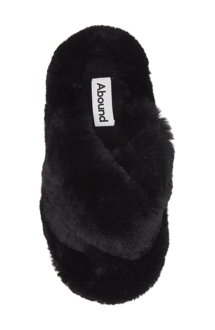 Plush faux fur straps and a footbed envelop your feet in comfort, allowing you to lounge in style. Polyester faux fur upper and lining/rubber sole Imported Black Faux Fur Slippers For Winter, Black Plush Lined Winter Slippers, Comfortable Black Slippers With Faux Fur Lining, Black Faux Fur Slippers With Round Toe, Black Fluffy Slippers For Winter, Black Synthetic Slippers With Faux Fur Lining, Black Slippers With Faux Fur Lining, Black Soft Synthetic Slippers, Soft Black Winter Slippers