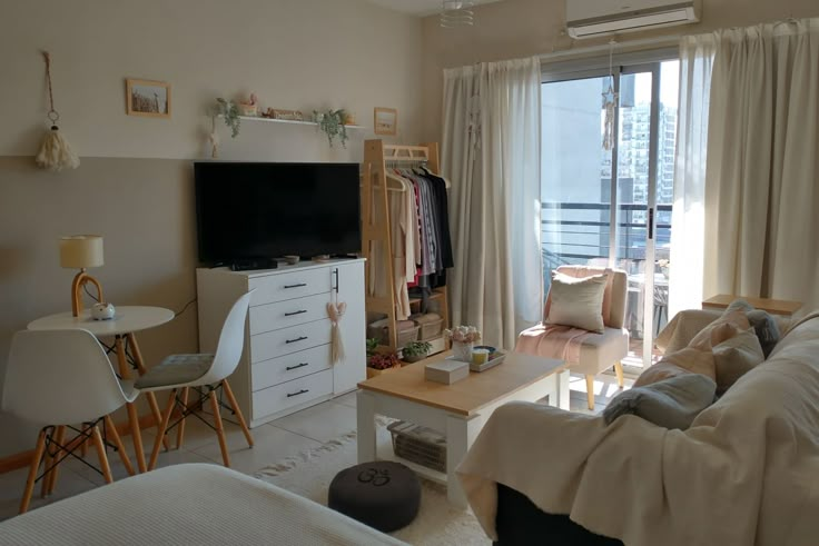 a living room filled with furniture and a flat screen tv