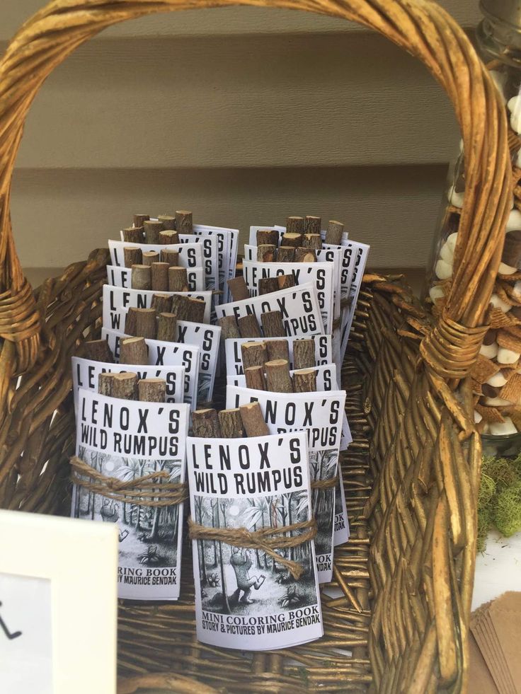 baskets filled with newspaper sitting on top of a table next to a sign that says lenox's wild rumps