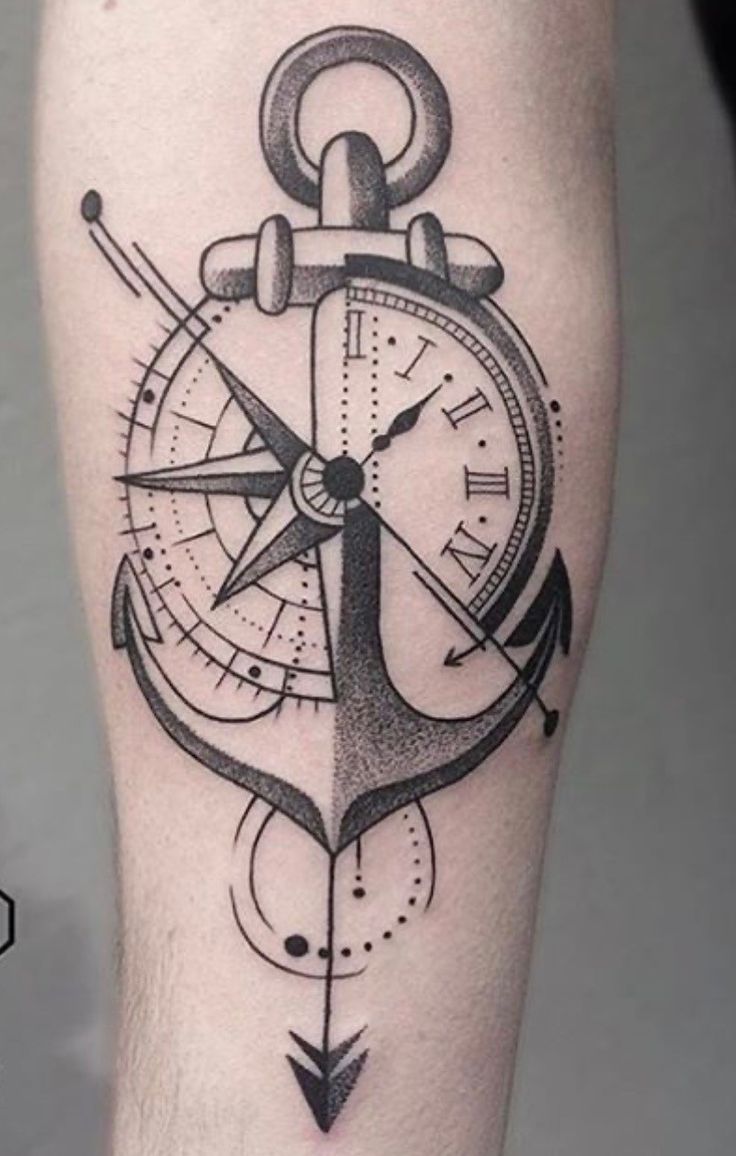 an anchor and compass tattoo on the leg