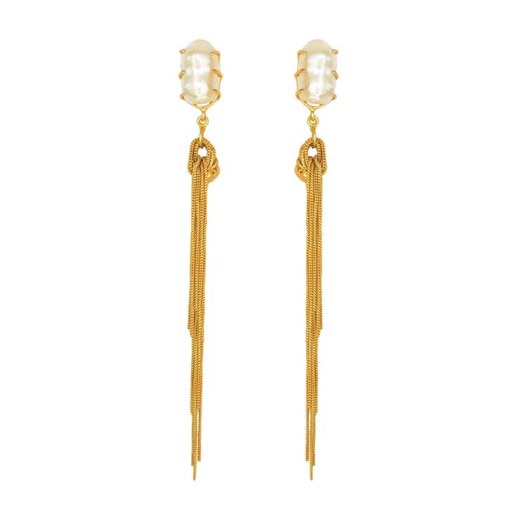 The Corina drop earrings feature raw natural baroque pearls with cascading 22k gold-plated brass fringe chains. These beautiful vintage statement earrings are the perfect touch of elegant and classic. Handcrafted in India by artisans. Limited quantity available.For pierced ears22ct gold plated brassCream raw baroque pearls L: 5" longW: 5/8" wideWeight: 11gA Note On Pearl: June's birthstone, said to symbolize a pure heart and mind, innocence and faith. With links to the moon and water, helping to Vintage Statement Earrings, Pure Heart, Pearl Dangle Earrings, Pearl Earrings Dangle, Heart And Mind, June Birth Stone, Baroque Pearls, Natural Pearls, 22k Gold