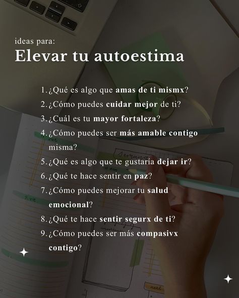 a hand holding a pencil over a notebook with the words elevar tu autoestima written in spanish