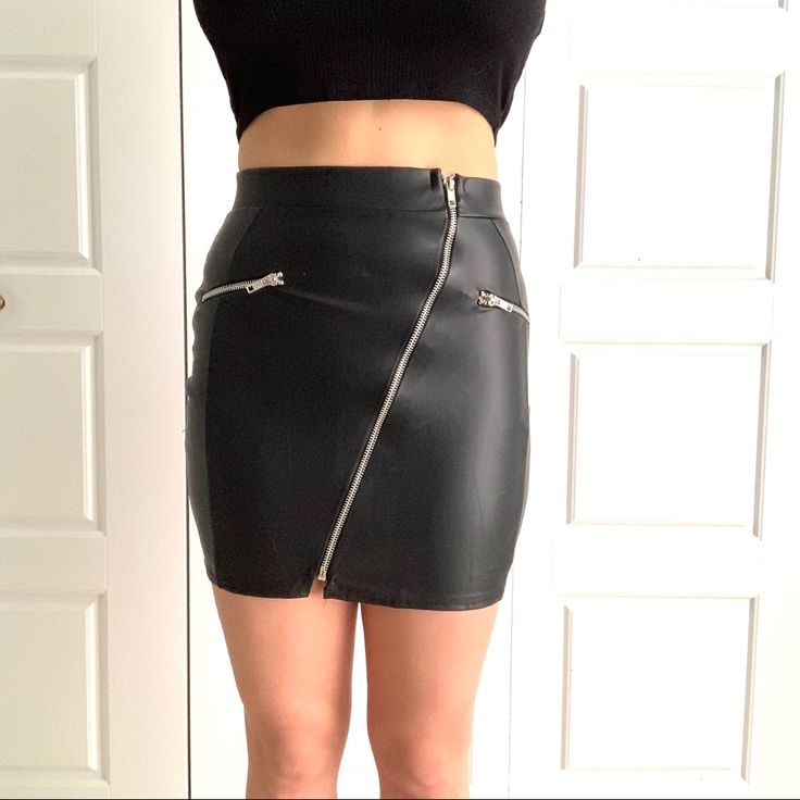 Nwt, Has A Bit Of Stretch. Large Zipper Unzips And That��’s How The Skirt Is Put On/Off. I’m 5’3” And My Waist Is About 26.5” And Hips About 34.5”. It Is A Bit Tight On Me. Tags Vegan Pleather Edgy Punk Edgy Mini Skirt With Zipper Closure For Fall, Fall Club Skirt With Zipper Closure, Black Mini Skirt With Zip Fly For Night Out, Trendy Zip Fly Skirt For Night Out, Trendy Skirt With Zip Fly For Night Out, Fall Mini Skirt With Zipper For Night Out, Black Skirt With Zip Fly For Night Out, Edgy Mini Skirt With Zipper Closure, Edgy Fitted Mini Skirt With Zipper Closure