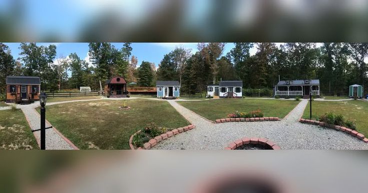 an aerial view of several small houses in a park