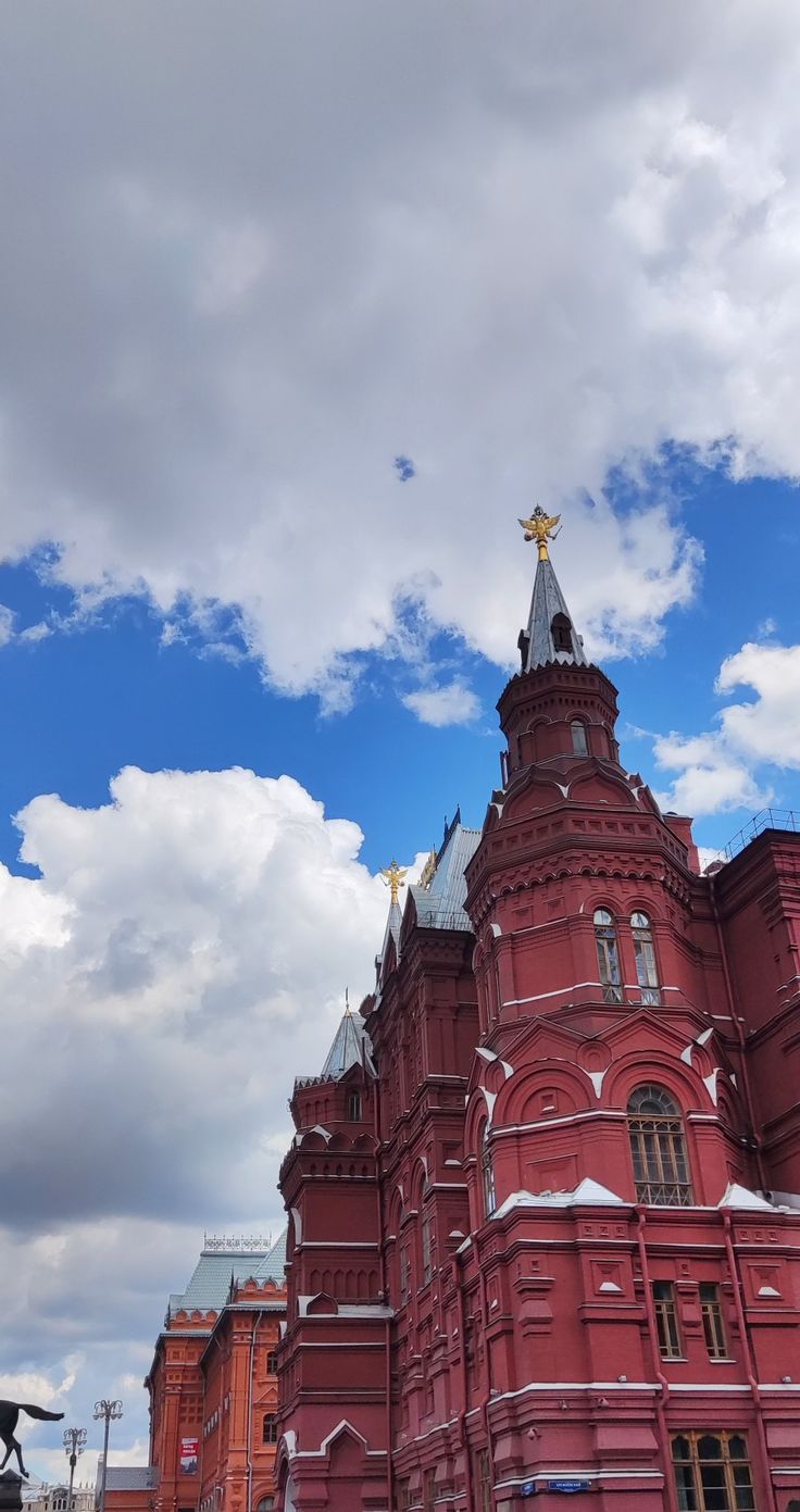 a large red building with a gold star on top