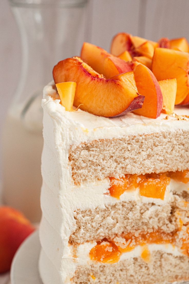 a piece of cake with peaches on top