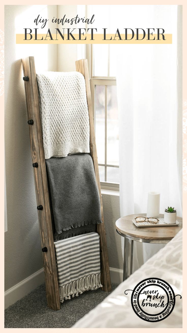 a wooden ladder leaning against a wall next to a window with the words, my husband blanket ladder