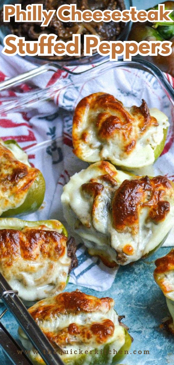 baked stuffed peppers with cheese and sauce in glass baking dish on colorful cloth next to utensils