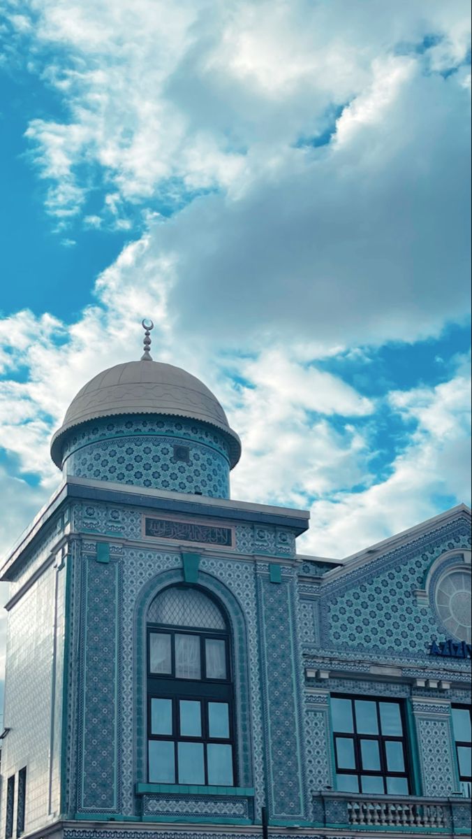 an ornate building with a blue sky in the background