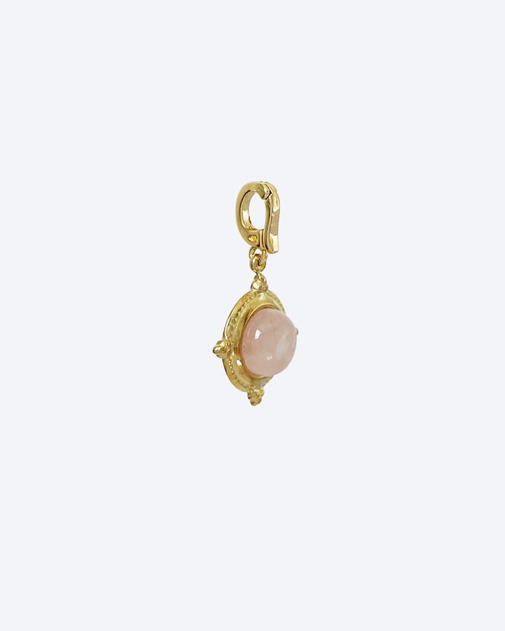 Embrace the soft and gentle energy of rose quartz with this exquisite charm. Encased in a delicate circle frame, it brings a touch of elegance to your beaded bracelets and necklaces. Radiate love and beauty with this captivating piece.💎 Gold-Plated Recycled Brass*Please note these clip-on charms are only suitable for necklaces and bracelets with under 4mm chain width or beaded pieces. Elegant Rose Quartz Healing Jewelry, Elegant Rose Quartz Jewelry For Healing, Dainty Rose Quartz Pendant Jewelry, Gold Rose Quartz Round Pendant Jewelry, Bohemian Rose Quartz Round Jewelry, Rose Gold Jewelry With Round Rose Quartz Beads, Feminine Round Jewelry With Pearl Charm, Elegant Pink Charms For Jewelry Making, Feminine Pearl Charm Jewelry