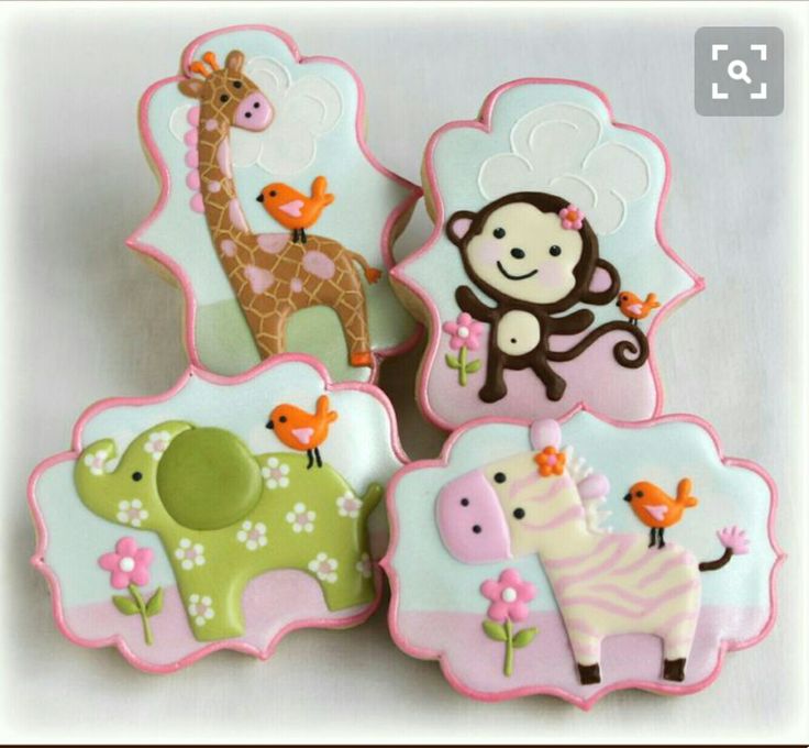 decorated cookies in the shape of animals and giraffes