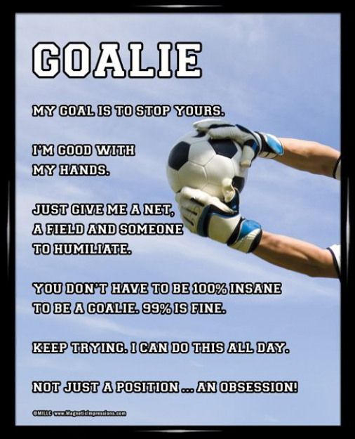 a soccer goalie's glove and ball in the air