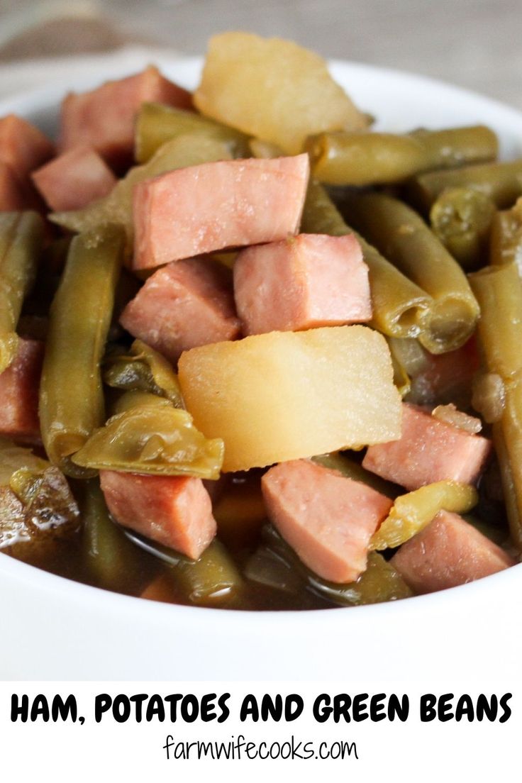 ham, potatoes and green beans in a white bowl with text overlay that reads ham potatoes and green beans