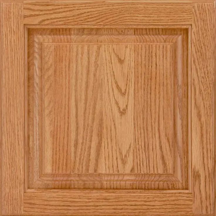 a close up view of the top of a cabinet door with wood grained finish