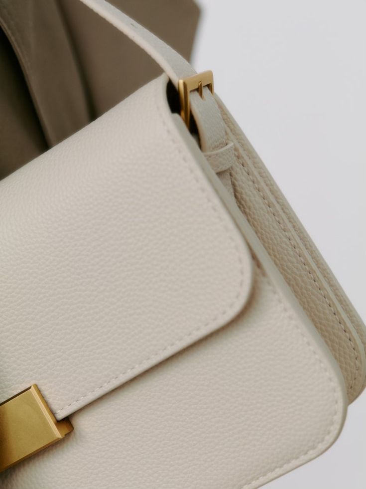 Our best selling classic shoulder bag now comes in a pebble cream leather as requested by so many of our customers. Born out of the desire for a classic and understated accessory that can elevate any outfit effortless and take you from work to weekend. Cream Crossbody Shoulder Bag For Work, Beige Shoulder Bag With Smooth Grain For Everyday, Beige Smooth Grain Shoulder Bag For Everyday, Everyday Beige Shoulder Bag With Smooth Grain, Elegant Neutral Shoulder Bag With Adjustable Strap, Classic Cream Bags For Everyday Use, Cream Top Handle Flap Bag For Everyday, Everyday Cream Flap Bag With Top Handle, Cream Shoulder Bag With Adjustable Strap For Work