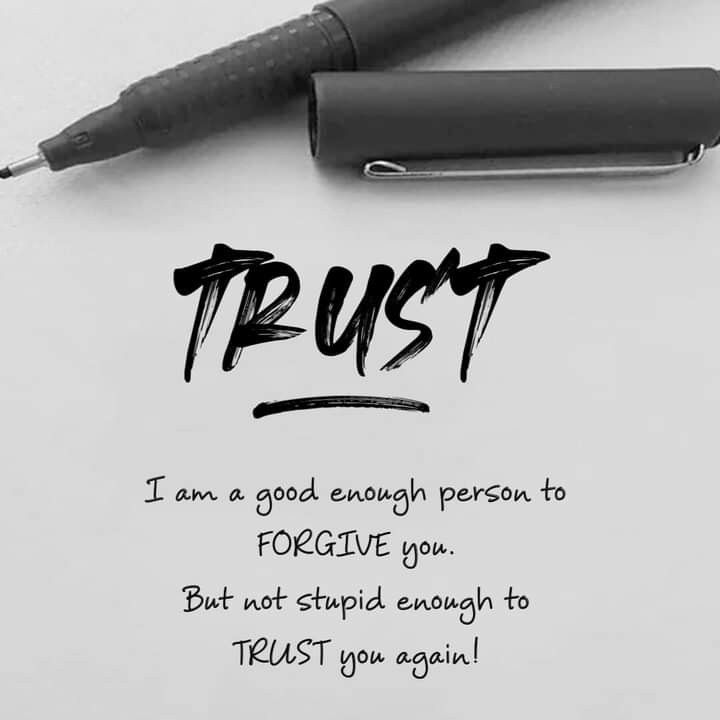 a pen sitting on top of a piece of paper with the words trust written across it