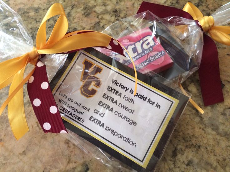 an item is wrapped in plastic and tied to a ribbon on a counter top with other items