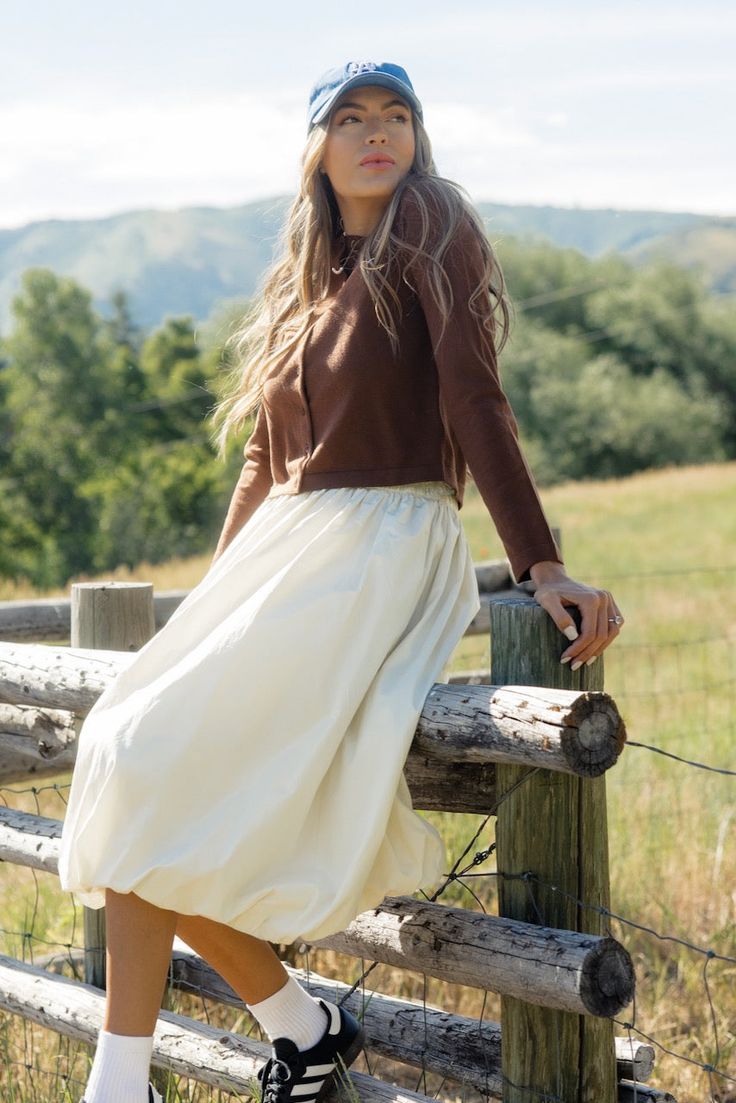 Who doesn't love a cardigan that can double as a top? The Down Bad Button Cardigan features a round neckline, functional buttons, and a cropped fit. We love it buttoned up for a fun take on a simple long-sleeve tee! soft and stretchy // paired with the bella skirt Spring Long Sleeve Cropped Sweater With Buttons, Spring Cropped Long Sleeve Sweater With Buttons, Cropped Tops With Button Cuffs For Fall, Baby Bow Hats, Down Bad, Milk Baby, Delivery Gown, Nursing Wear, Going Home Outfit