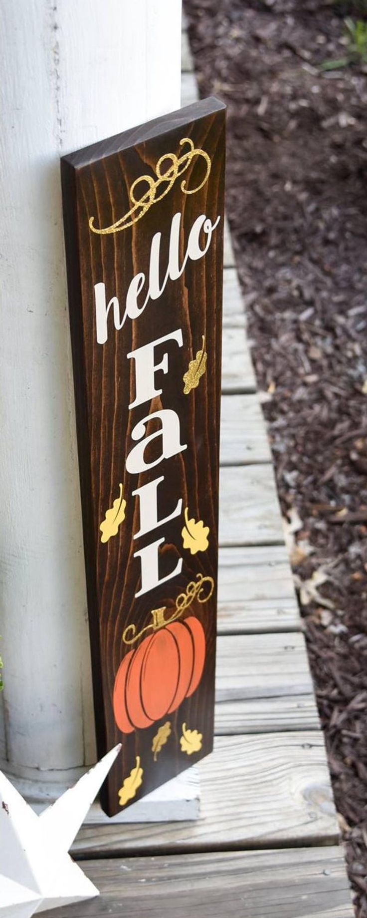 a wooden sign that says hello fall on it