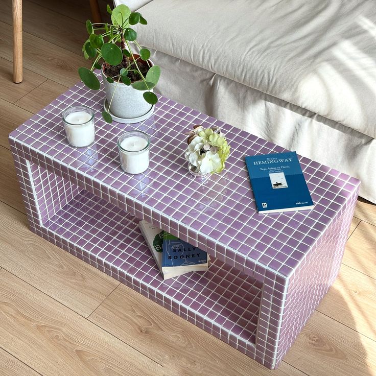 a coffee table with books and cups on it