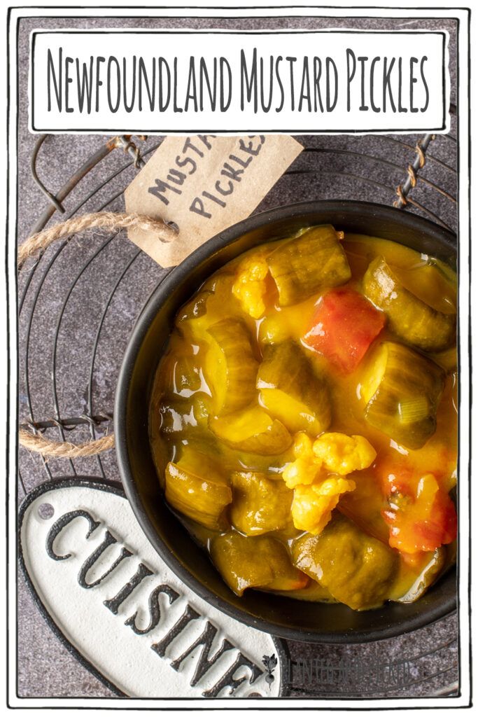 a bowl filled with food sitting on top of a metal rack next to a sign