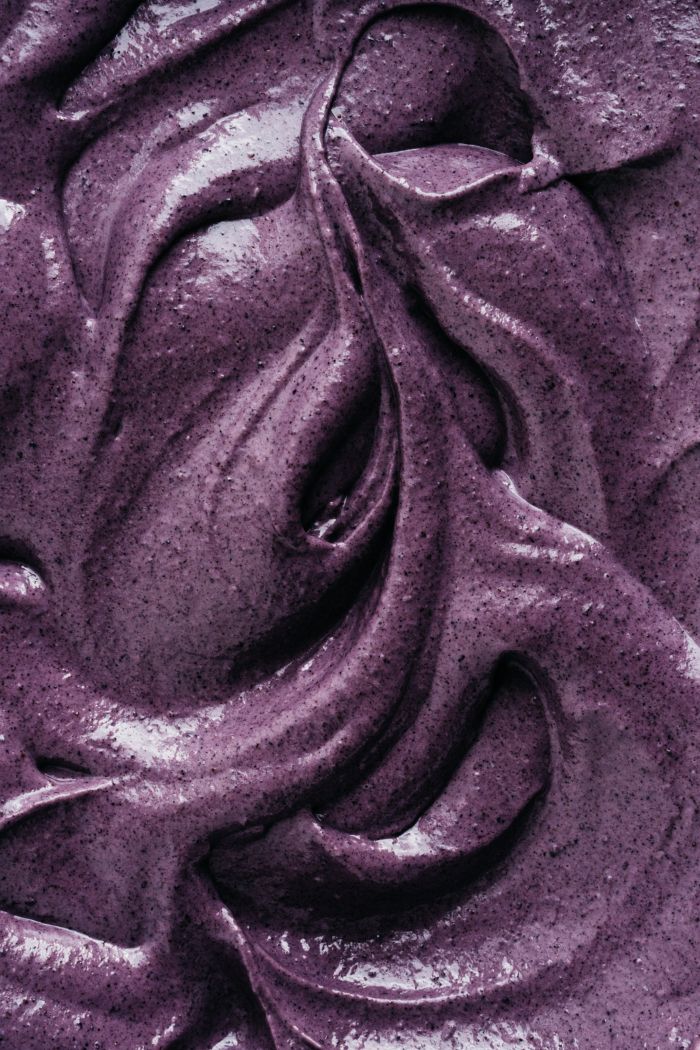 a close up view of purple paint that looks like it has been swirled in the wind