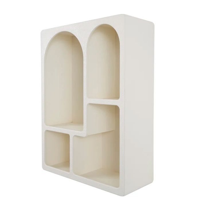 a white shelf with three compartments on each side and an open section in the middle