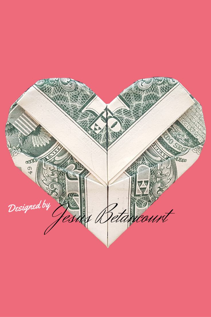 an origami heart made out of money