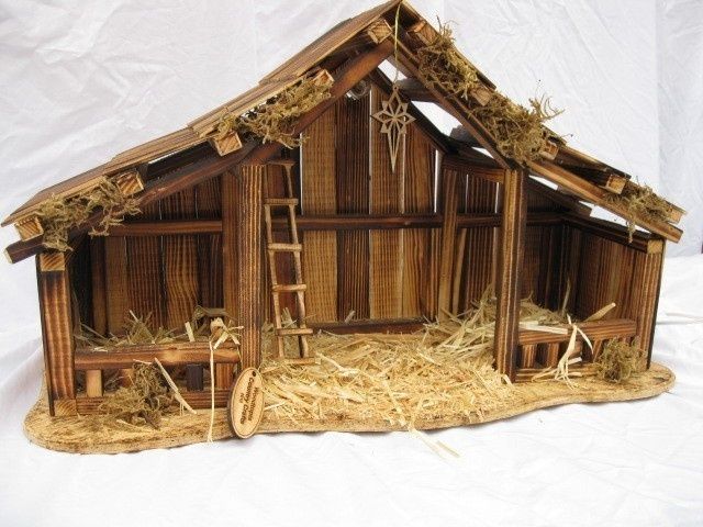 a nativity scene made out of wood and straw