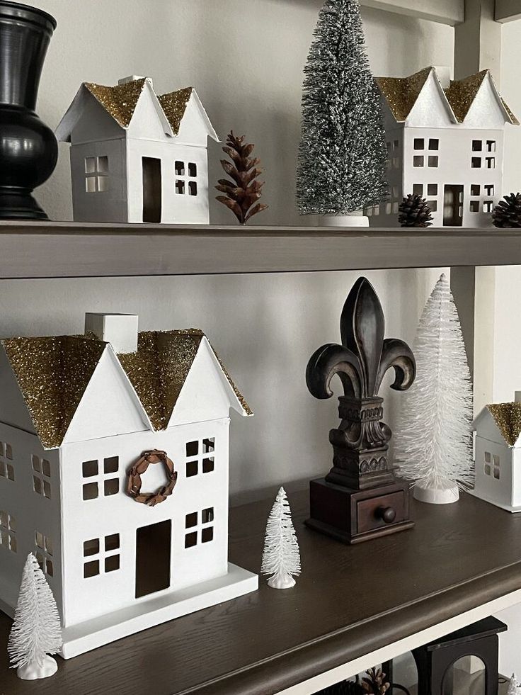 a shelf with christmas decorations on it and the words how to make your own christmas village