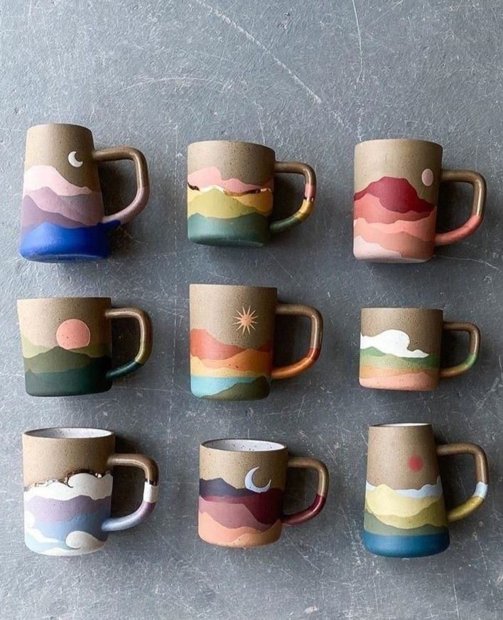 six coffee cups with different designs on them sitting next to each other in front of a gray background