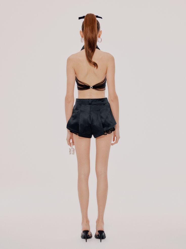 Give your weekend wardrobe a fierce update with these shorts. Featuring a black material with pleat detailing and a turn-up hem design. Style with a statement top, gold accessories and on oversized blazer for brunch with the ladies! Pleat Detail Mesh Detail SIZE & FIT Model is wearing a size M Model is 5'8 & 110 lbs FABRIC Side A: 62.7% cotton 37.3% mulberry silk Side B: 100% nylon (except sequins) Lining A: 100% polyester Lining B: 100% nylon Chic High-waisted Shorts For Night Out, Chic High-waisted Shorts For Date Night, Elegant High-waisted Shorts For Date Night, Elegant Shorts For Going Out, Chic Fitted Evening Shorts, Elegant Shorts For Night Out, Chic High-waisted Shorts For Evening, Elegant Shorts With Built-in Shorts For Night Out, Elegant High-waisted Shorts For Party