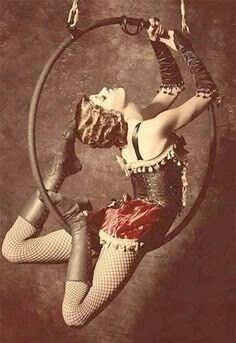 a woman is sitting in a hoop