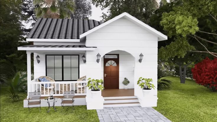 a small white house sitting on top of a lush green field