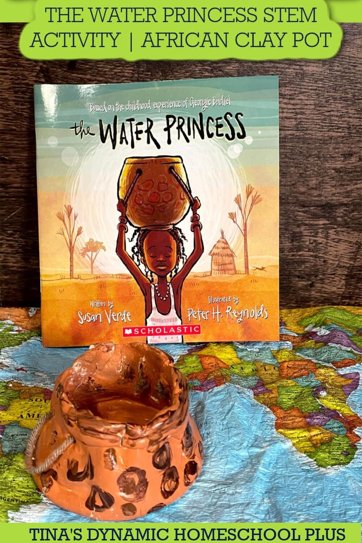 the water princess sits on top of a map and next to a book titled, the water princess