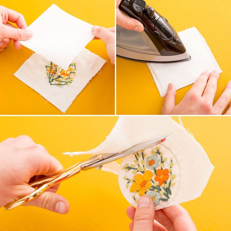 someone is using scissors to cut fabric with flowers on the napkins and ironing them