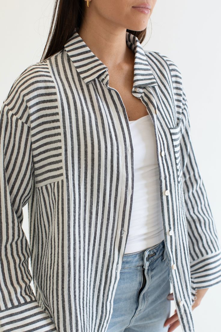 Stay cool and stylish this summer with our Zuma Button Down, featuring pretty iridescent buttons and a raw hem. This super lightweight top offers an effortless, relaxed, and roomy fit, making it perfect for warm weather. Best of all? Its 100% cotton! Wear it buttoned up for a polished look or unbuttoned over a swimsuit or tank for a breezy, casual vibe. This versatile piece is a must have summer staple! Malibu Collection FIT Relaxed Roomy Fit Iridescent Buttons High-Low Raw Hem Clancy is 5'9 Wea Effortless Everyday Shirt With Buttons, Effortless Button Shirt For Everyday, Versatile Button-up Vacation Tops, Versatile Button-up Tops For Vacation, Summer Shirt For Everyday Wear, Summer Everyday Shirt, Summer Tops In Relaxed Fit With Button-up, Summer Tops With Relaxed Fit And Button-up, Summer Relaxed Fit Button-up Top