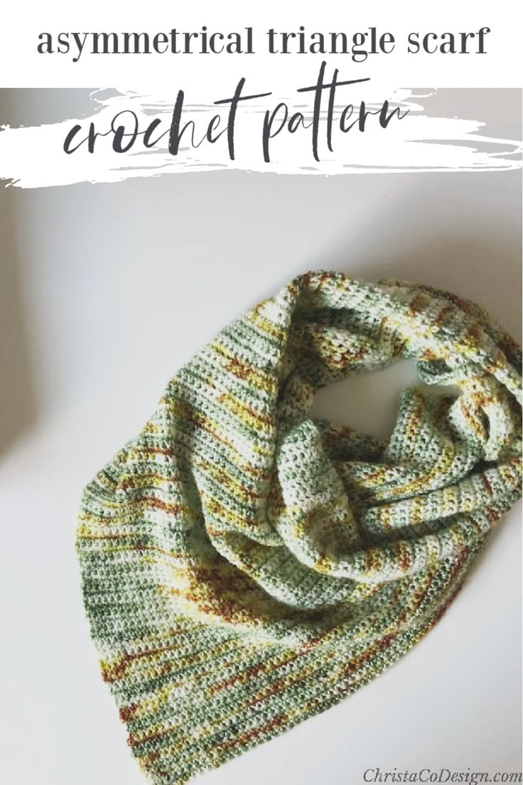 a green and yellow knitted scarf with text overlay that says, asymmetrical triangle scarf crochet pattern