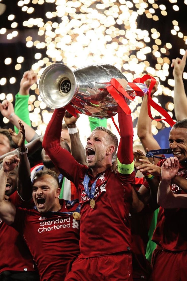 liverpool's players celebrate with the trophy