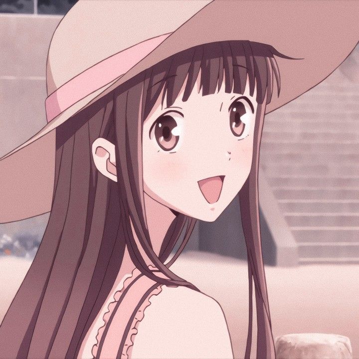 a girl with long hair wearing a hat