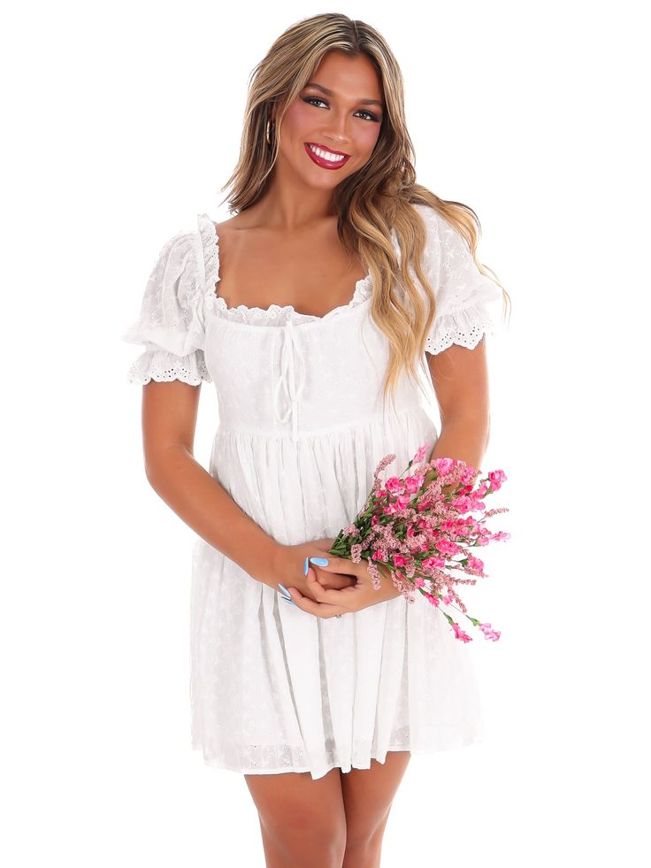 Embark on a new fashion journey with our New Adventure Mini Dress! This off white dress boasts embroidered eyelet detail, shirring front tie, and a back zip closure for easy dressing. Its lined construction and short sleeves with elastic and ruffled cuffs add a touch of comfort to its stylish design. Let this dress take you on a playful and unique style adventure! Summer Eyelet Dress With Short Sleeves, White Short Sleeve Mini Dress With Eyelet Details, White Eyelet Short Sleeve Mini Dress, White Eyelet Mini Dress With Short Sleeves, Short Sleeve Lace Mini Dress With Broderie Anglaise, Broderie Anglaise Mini Dress With Short Sleeves For Brunch, Eyelet Short Sleeve Dresses For Brunch, Short Sleeve Eyelet Dress For Brunch, Casual Short Sleeve Broderie Anglaise Mini Dress