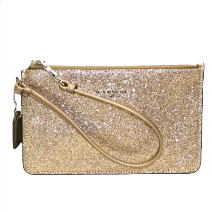 A Lil’ Cute Essential Color: Champagne Gold Coach Emblem On Front Two Interior Card Slots Zip Closure Glitter Texture On Front Side Only Leather Material Approx. Size 4 1/4”H X 7”W X 1/8”D Approx. Strap Drop 6” Plz Adjust For Lighting No Trades Free Gift W/Purchase Same-Day Shipping Eyeit-Buyit Coach Gold Clutch Wristlet, Gold Coach Clutch Wristlet, Elegant Gold Coach Wristlet, Coach Gold Rectangular Wristlet, Gold Rectangular Coach Wristlet, Gold Wristlet For Parties, Coach Clutch Wristlet For Evening, Elegant Gold Wristlet For Evening, Elegant Gold Coach Clutch