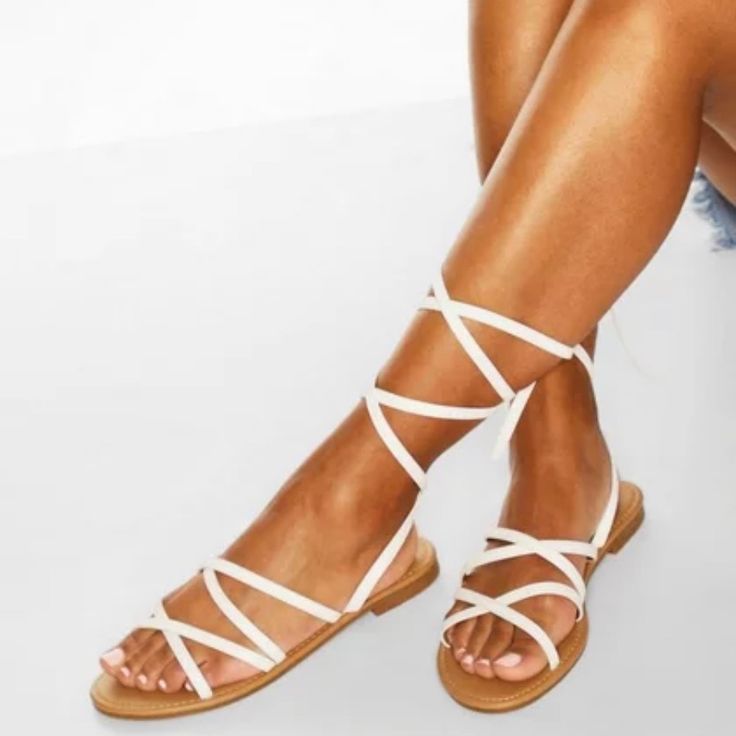 These Strappy Tie Sandals Are Chic Yet An Understated Vibe. Strappy Sandals Are All About Minimalism. These Have A Light And Airy Design. You Can Tie Them Low Around The Ankles Or High All The Way Up Your Calf. Size Is A Women’s 5. Brand New In Original Box. Try On Condition. Ships Same Day If Order Is Placed Before 3 Pm Eastern Time. Otherwise Your Order Is Processed/Shipped The Next Business Day (M-F). Please Do Not Hesitate To Contact Me With Any Questions Or If You Need Additional Photos. Ip White Strappy Sandals For Summer, Casual Spring Toe Post Lace-up Sandals, Trendy White Lace-up Sandals For The Beach, White Strappy Lace-up Sandals For Spring, Casual Ankle Wrap Sandals For Summer, Summer Strappy Lace-up Sandals In Synthetic, White Lace-up Summer Sandals With Round Toe, White Strappy Summer Sandals, White Round Toe Lace-up Summer Sandals