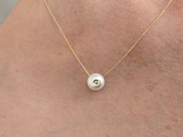 We are not talking about diamonds and pearls, we are talking about diamonds in pearls. A patented design of embedding a small diamond into a cultured pearl. This is a stunning new concept and an extremely special design for life's amazing events. Arriving just in time for Graduation, Mother's Day, Anniversary season and, of course, pearl month coming up in June! If you are looking for something incredibly special, you just found it! Designed by the Chi, the artist behind Galatea. We got to know this designer last month and begged him to let us carry these designs (and offer them at a discount to our amazing Pearl Girls!). We are so excited to offer the diamond in pearl designs. We have dangle earrings, stud earrings and pendants. Buy a set and save! Available in 14k yellow gold but we can Delicate Diamond Jewelry With Pearl Drop, Elegant Earrings With Diamond Eyes, Pear-shaped Diamond Jewelry With Pearl Drop, Pear Shaped Diamond Jewelry With Pearl Drop, Diamond Pearl Earrings With Diamond Accents As Gift, Diamond-accented Pearl Earrings For Gift, Elegant Round Jewelry With Diamond Eyes, Pear-shaped Single Diamond Jewelry, Pearl Jewelry With Diamond Accents In Pear Shape